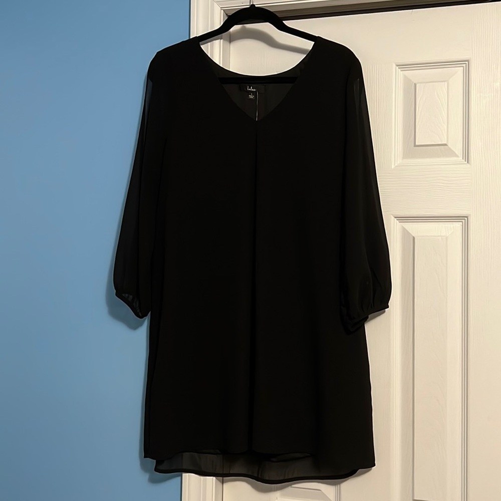 Women’s black dress size L. Never worn